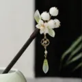 Close-up detail of traditional Chinese lily of the valley wooden hairpin with tassel. - 1# White Lily of the Valley