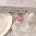Close-up detail of a sweet pink and white floral hair clip, cute aesthetic hair accessory. - Light Pink Stamen