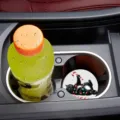 Detailed view of a cute black cat car coaster featuring Christmas lights in cup holder. - 7cm02