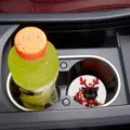 Silicone car cup coaster detail view, showing cute black cat design inside vehicle holder. - 7cm01