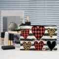 Detail view of the stylish canvas cosmetic bag featuring cute heart patterns and stripes. - Heart Printed