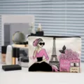 Canvas cosmetic bag detail showing stylish Paris fashion illustration print, zipper pouch design. - Parisian Style