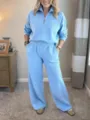 Detailed view of the light blue half-zip sweatshirt and wide-leg pants loungewear set worn. - S / Top And Bottom / Sky Blue