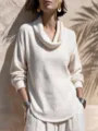 Close-up detail of the white ribbed cowl-neck long-sleeve knit top with curved hem. - S / Tops / Milky White