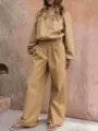 Detail view of beige casual two-piece tracksuit, loose wide-leg pants and crop jacket. - Khaki
