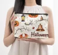 Detail view of autumn Halloween canvas makeup bag with festive watercolor pumpkin prints. - Purple Embroidery (05)