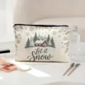 Close-up detail of the canvas cosmetic pouch featuring winter snow cabin print and zipper closure. - Snowy House Style