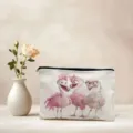 Detailed view of the canvas cosmetic bag featuring cute flamingo print, presented with rose. - Flamingo Pattern