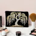 Detailed view of black canvas makeup storage bag featuring a stunning pearl willow tree print. - Beaded Tree Pattern (01)