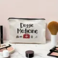 Detail view of white canvas zipper pouch with pet medicine print, cosmetic bag close up. - Off-White (Doggie Medicine Print)