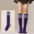 Detailed view of purple knee high socks featuring three white stripes, comfortable fit. - One Size / Dark Purple with White Stripes Calf Socks