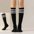 Black knee high socks with three white stripes, perfect for casual wear and JK outfits. - One Size / Black with White Stripes Calf Socks