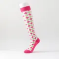 Detail view of women's knee high argyle socks featuring pink green and white pattern. - S/M / Pink