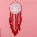 Red dream catcher hanging ornament with white lace web, beads and feathers for home decor. - Red