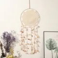 Handmade bohemian dream catcher wall hanging with feathers and lace for home decor detail. - L / Beige