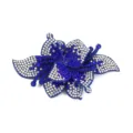 Detailed close-up of a sparkling blue rhinestone flower patch, shoe flower accessory. - Sky Blue