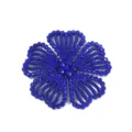 Blue rhinestone flower detail close-up, sparkling crystal craftsmanship for custom apparel decor. - Dark Blue