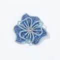 Detailed view of the blue rhinestone flower patch, showing sparkling crystal embellishments. - Light Blue
