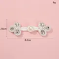 Detail shot of handmade pearl rhinestone Chinese knot button, decorative clothing accessory. - Style 3