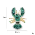 Detailed view of handmade beaded lobster patch with green crystals and gold silk embroidery. - Lobster 2 Style
