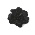 Detailed close-up of a black rhinestone flower accessory, sparkling glass crystal design. - Black