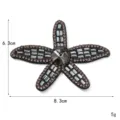 Dettaglio patch a stella marina in strass scintillanti, decorazione preziosa per abiti. - Stella marina nera
