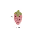 Rhinestone strawberry patch detail shot, sparkling pink and green crystals on fabric. - Strawberry