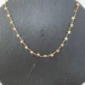 Dettaglio della catena a stella in rame per creazione di gioielli e accessori fai da te. - oro kc