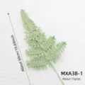 Detail shot of handmade knitted green fern leaf accessory, highlighting exquisite crochet details. - Fern