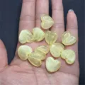 Close-up of acrylic cloudy heart beads with gold glitter for DIY jewelry making details - 16mm (Approx. 430 Pcs) / Yellow