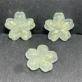 Closeup view of translucent green cherry blossom resin beads with gold glitter DIY accessories. - 22mm/Approx. 210 Pcs / Green