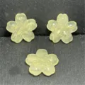 Close-up detail of translucent yellow resin sakura beads with gold glitter for DIY jewelry. - 22mm/Approx. 210 Pcs / Yellow