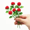 Handcrafted crochet mini red rose bouquet for festive home decoration and cute gifts. - 6-Piece Pack / Bright Red