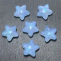 Detailed close-up of light blue mermaid style glittering star beads, perfect for DIY jewelry. - Blue