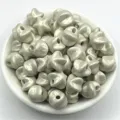 Close-up view of glossy pearly star shaped beads in a bowl for handmade DIY jewelry details - 11mm / Gray