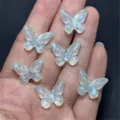 Detail shot of translucent resin butterfly charms with glitter and mermaid finish for DIY crafts. - 14x19mm 670 Pieces / Light Green