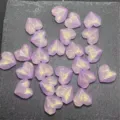 Close-up detail of purple glitter heart acrylic faceted beads for DIY handmade jewelry crafting. - Light Purple