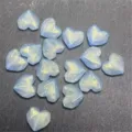 Acrylic faceted heart beads with gold glitter shimmer, detail close-up for DIY jewelry crafts. - Blue