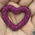 Close-up detail of a sparkly rhinestone heart craft charm, perfect for DIY jewelry making accessories. - 10010#