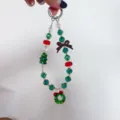 Detail view of Christmas crystal beaded keychain pendant and phone charm with cute holiday charms - Christmas Red Series