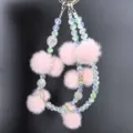 Pink plush pom pom phone chain crystal beaded wrist strap sparkle charm accessory detail - Pink