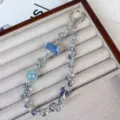 Exquisite crystal beaded phone charm bag pendant featuring rose flower and butterfly design. - Blue Rose