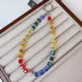 Detailed shot of a colorful crystal beaded phone charm wrist strap in a display tray - Rainbow Style