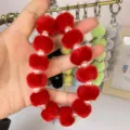 Plush pompom phone charm colorful fluffy ball keychain and bag accessory variant display - Red