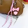 Pink bow and heart bag charm with braided rope stylish keyring purse pendant accessory - Pink
