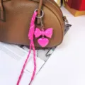 Pink bow heart keychain and braided rope bag pendant close up exquisite detail view - Rose Red