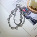 Handmade grey crystal beaded phone charm wrist strap featuring elegant bow detail - Transparent Gray