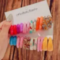 Colorful resin C-shaped hoop earrings set, trendy fashion jewelry display on cards, detail view. - Mottled Resin Style (Set 13)