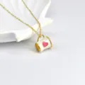 Closeup of a cute gold enamel coffee cup pendant necklace with a pink heart detail. - White Cup (X05080A)