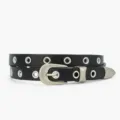 Ceinture fine en cuir noir pour femme avec œillets métalliques et boucle élégante. - Noir